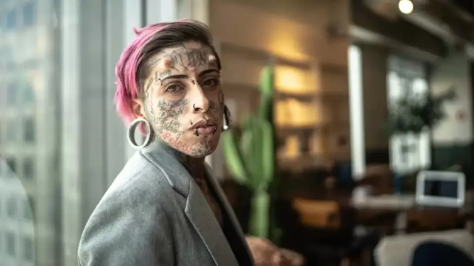Woman Ash Putnam not get job because of tattoos on face and neck